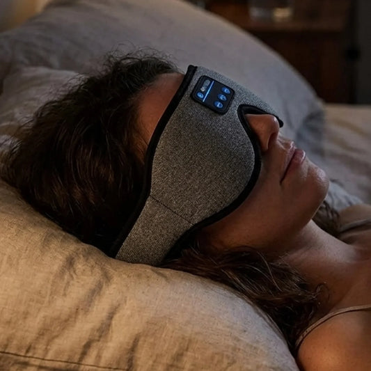 The Sound Sleep Mask worn in bed at night blocking light and playing sound — Kosient
