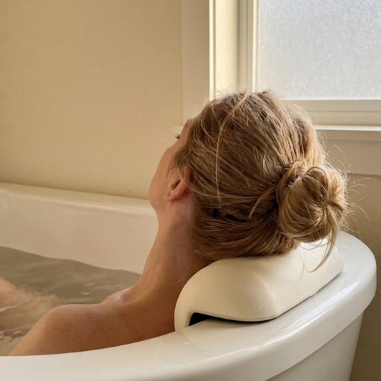 The Restore Bath Pillow supporting neck and shoulders in bath — Kosient