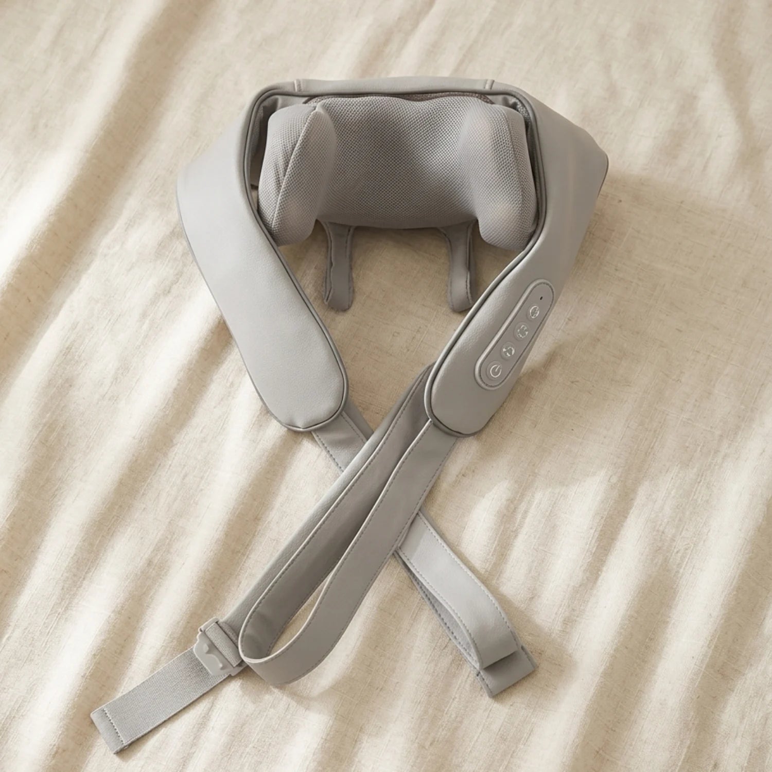 The Shoulder Drop neck and shoulder massager laid flat on neutral surface — Kosient
