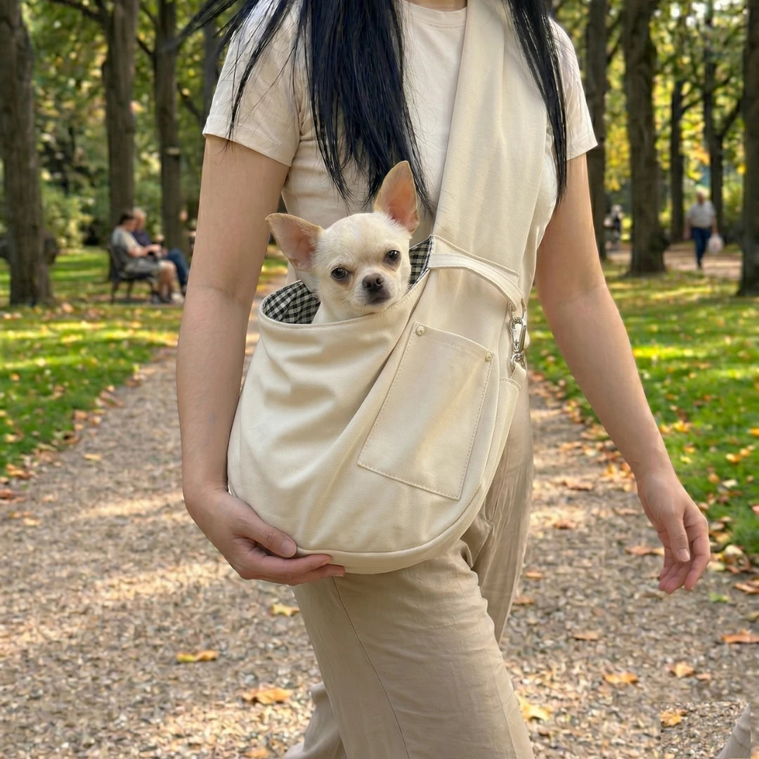 Dog Sling Carrier worn walking outdoors in park with Chihuahua — Kosient